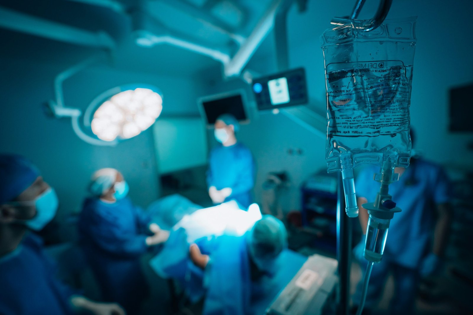 Indications for Abdominal Paracentesis:,a group of surgeons in a hospital operating room
