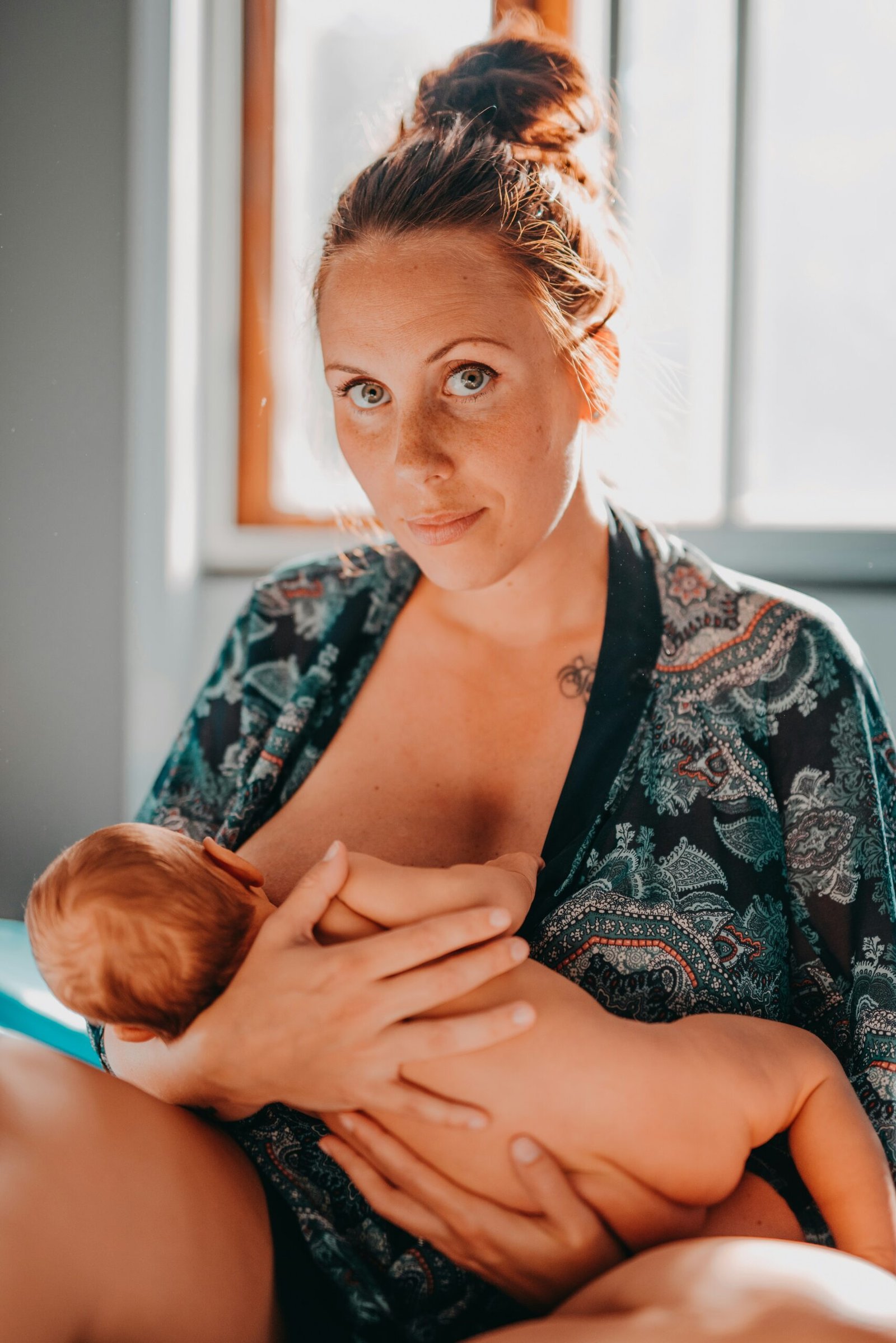 newborn feeding,breastfeeding woman on focus photography